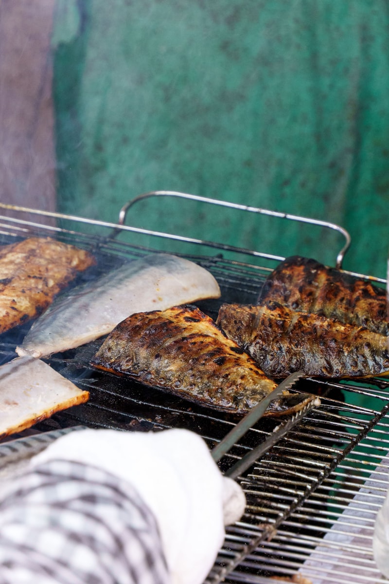 Mackerel fillets searing skin side down on a hot grill