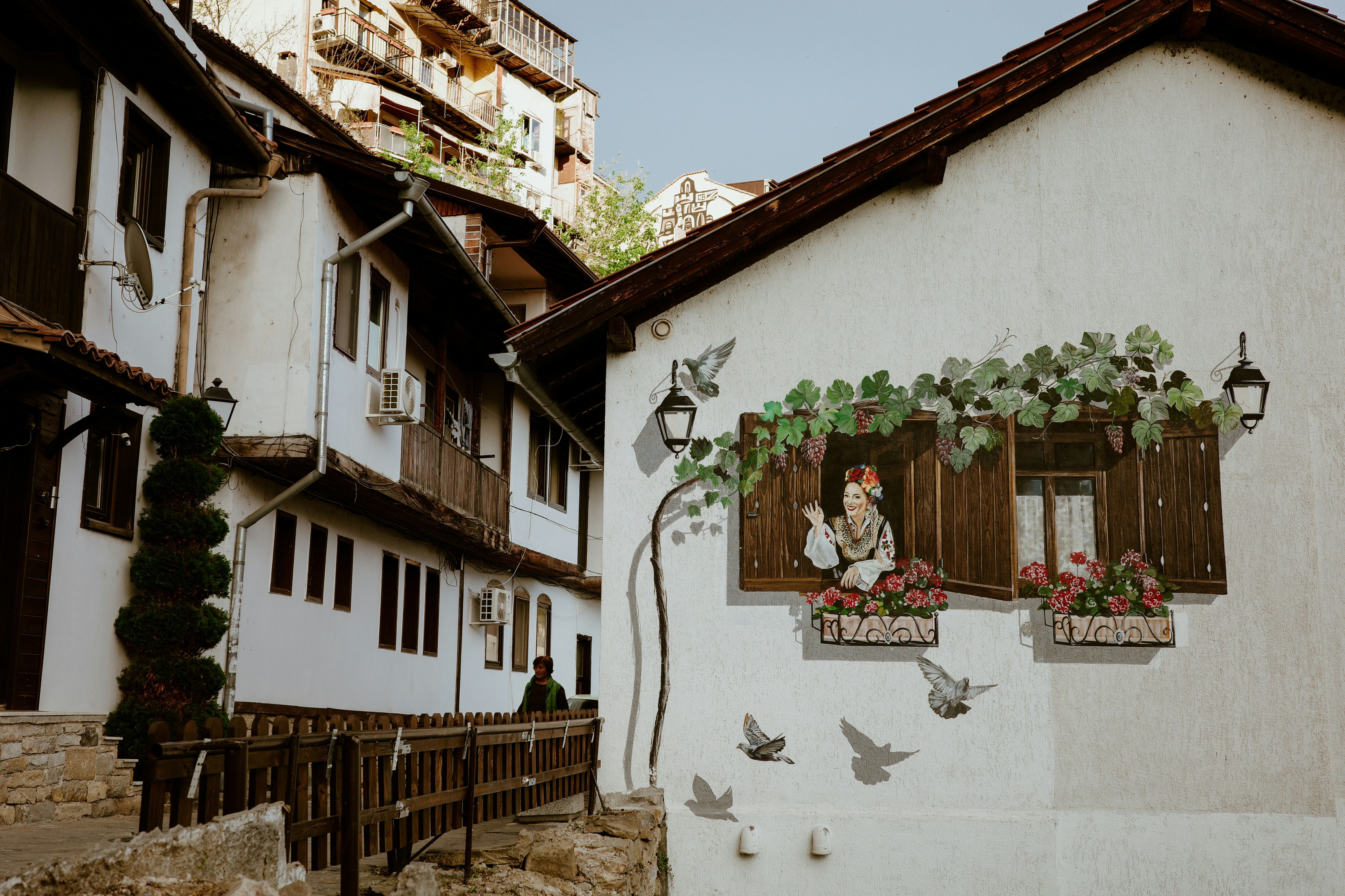 Painted buildings adorn a historic town scene.