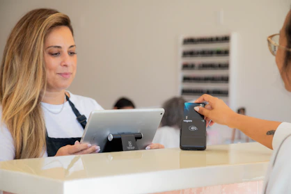 A woman is making a card payment.