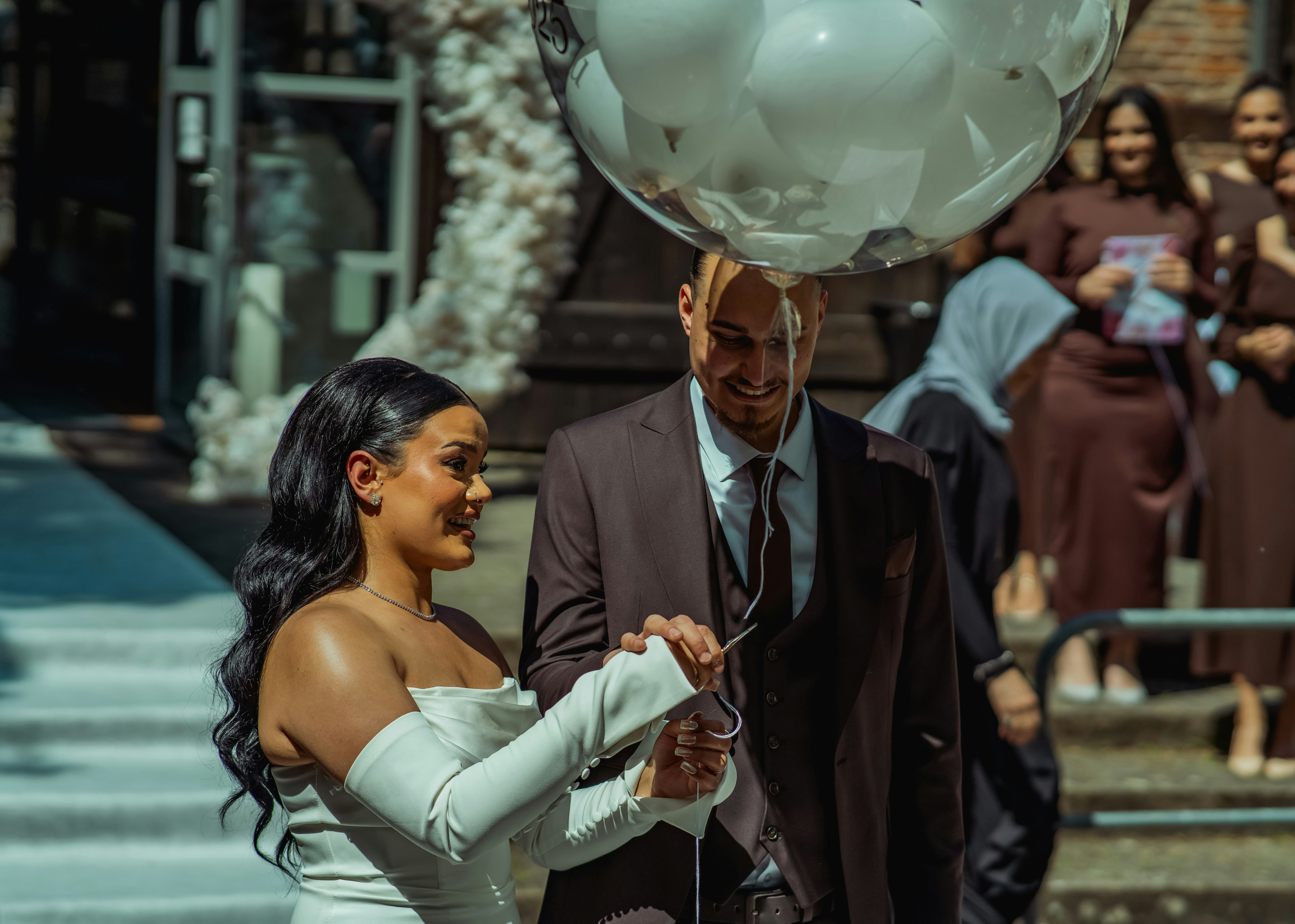 Newlywed couple with wedding balloon