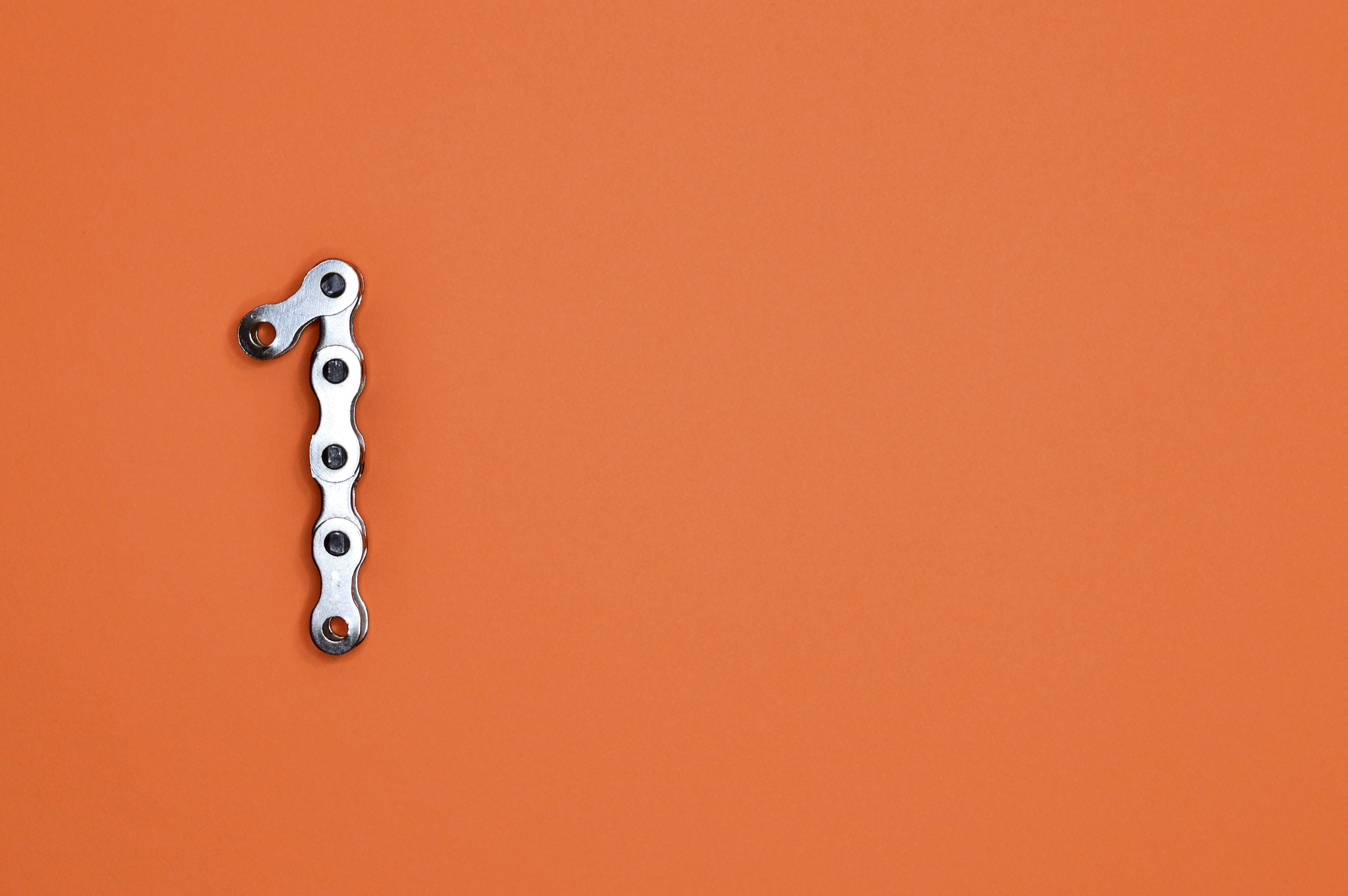 The number "1" is made of bike chain.