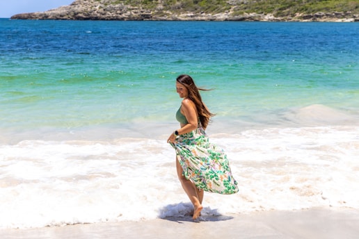 Woman enjoys the waves at a beautiful beach.