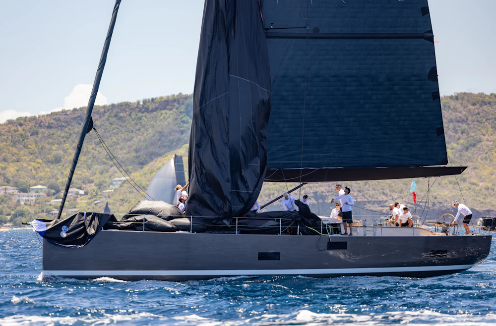Offshore racing yacht under full sail in blue water