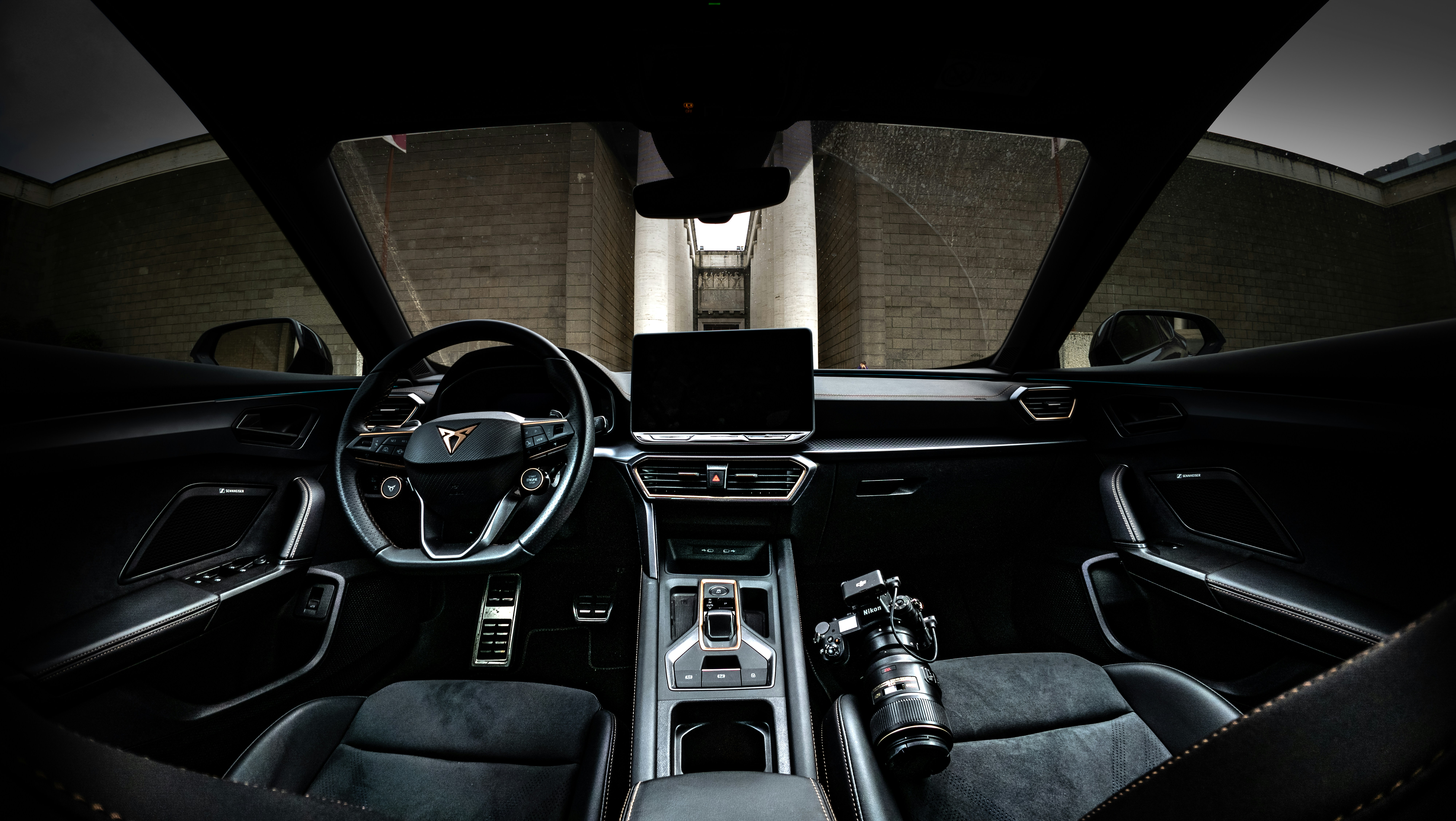 Luxurious electric pickup truck interior with large touchscreen and premium materials