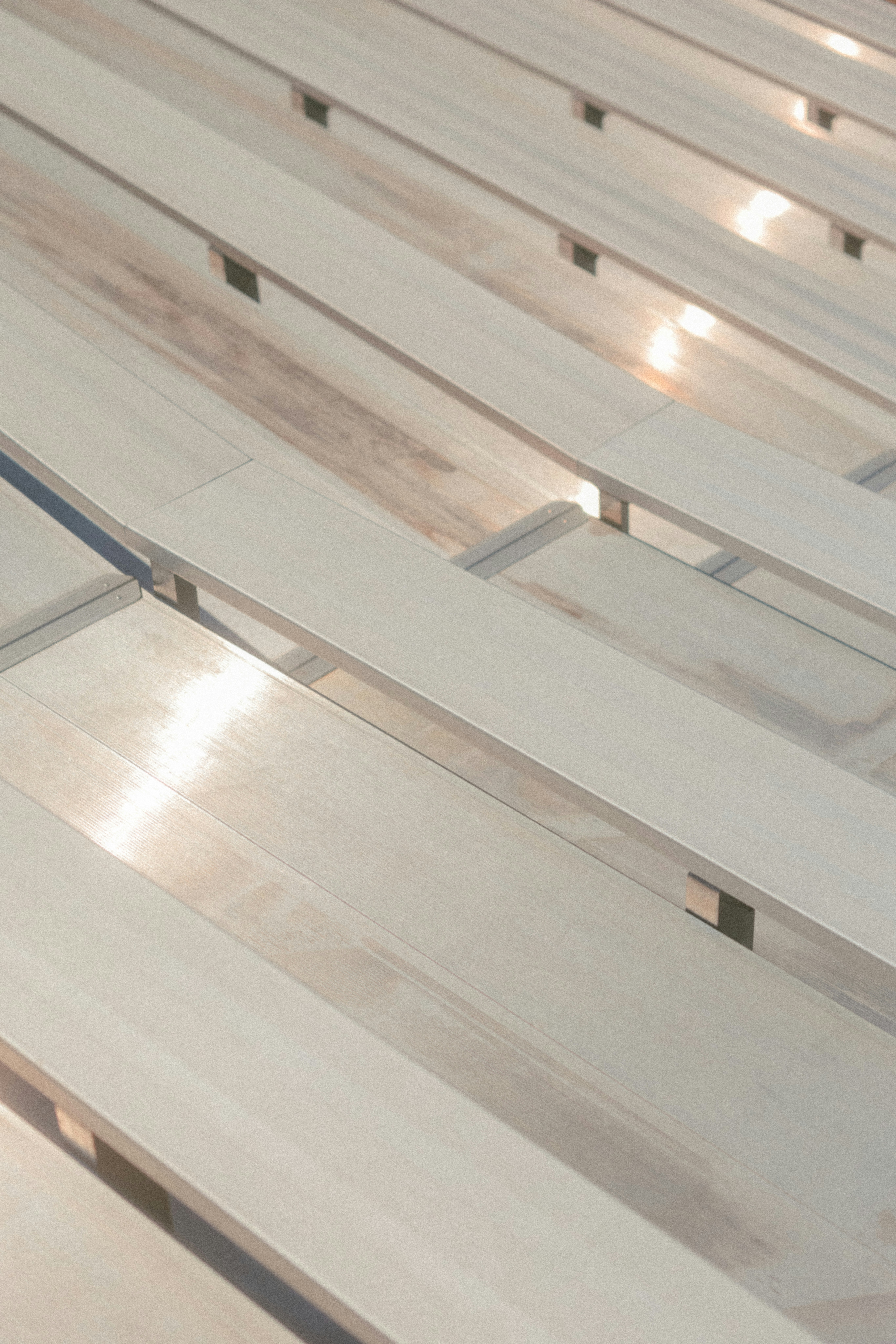 Wooden planks are arranged with light reflecting.
