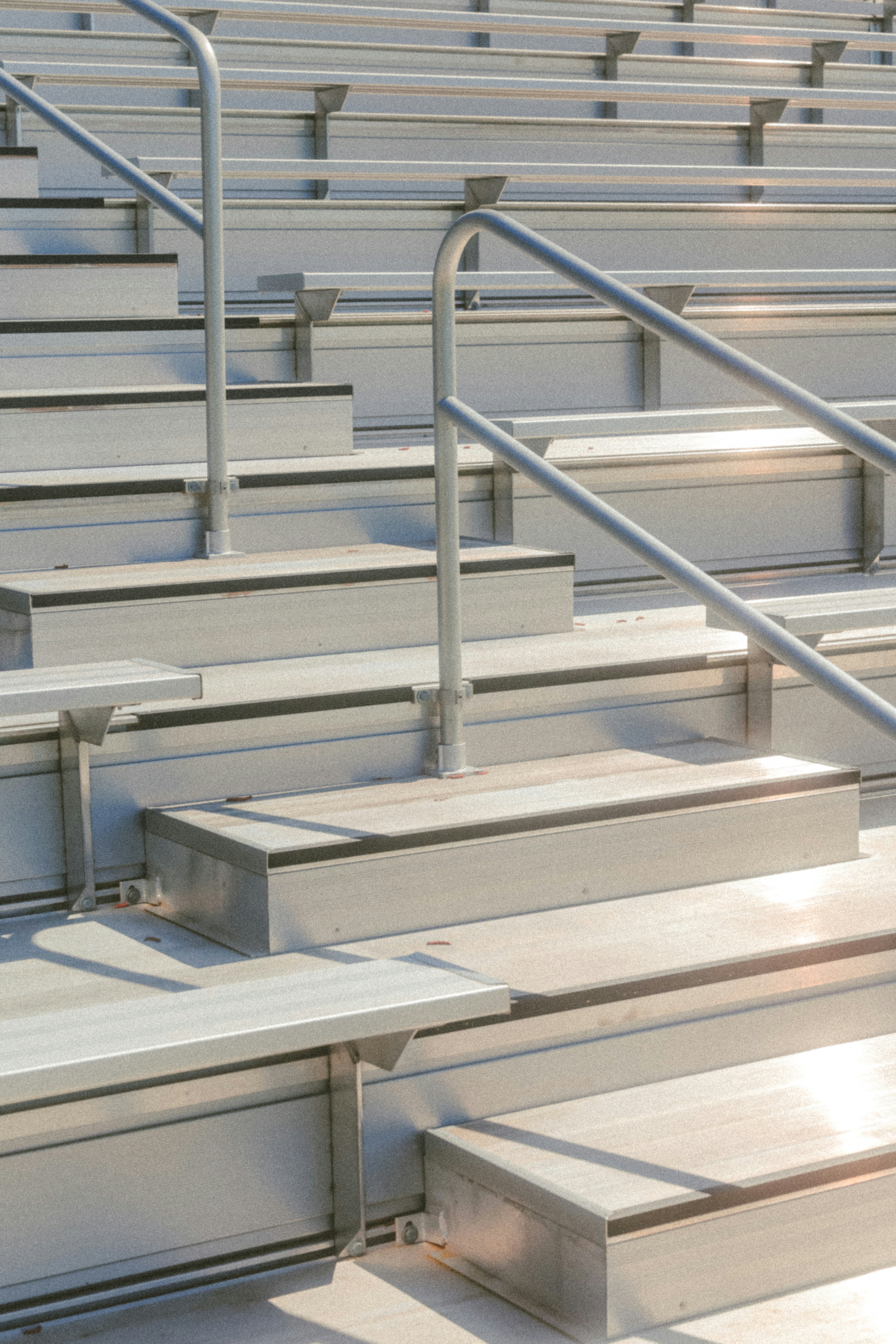 Empty stadium bleachers are ready for spectators.