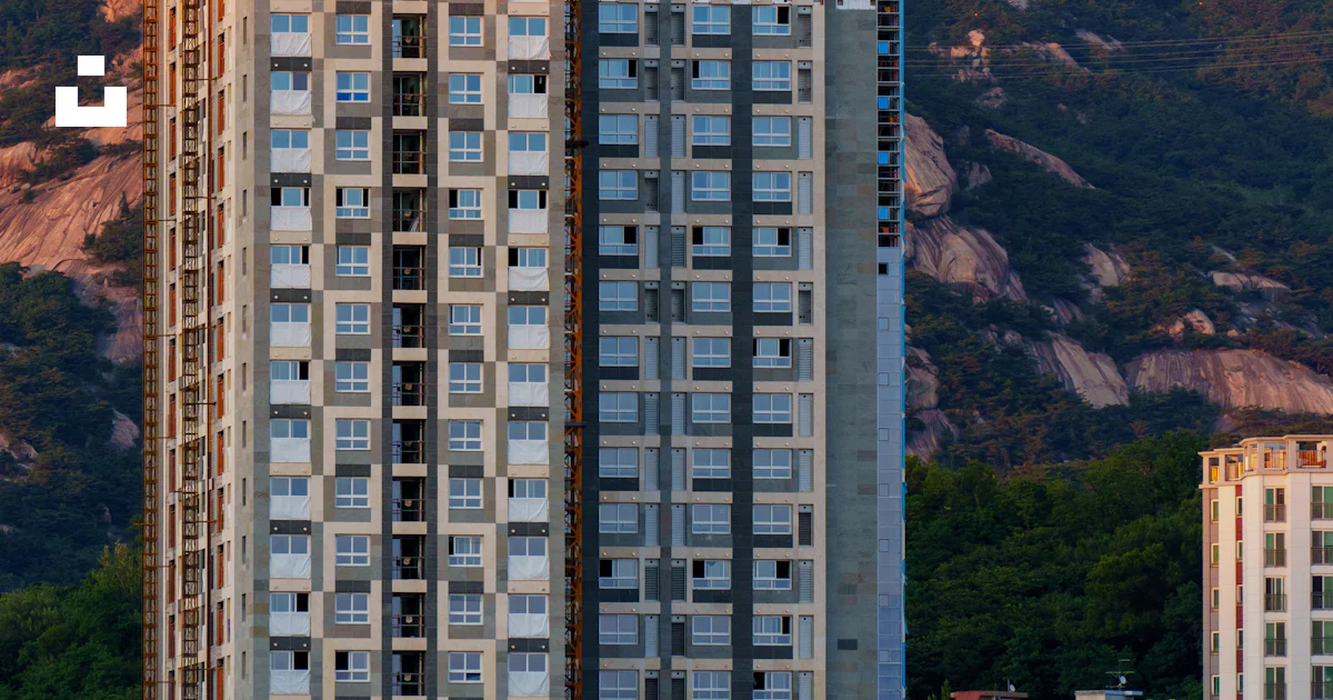 Atop Rise Construction crane atop a high-rise building. photo – Free Building ...