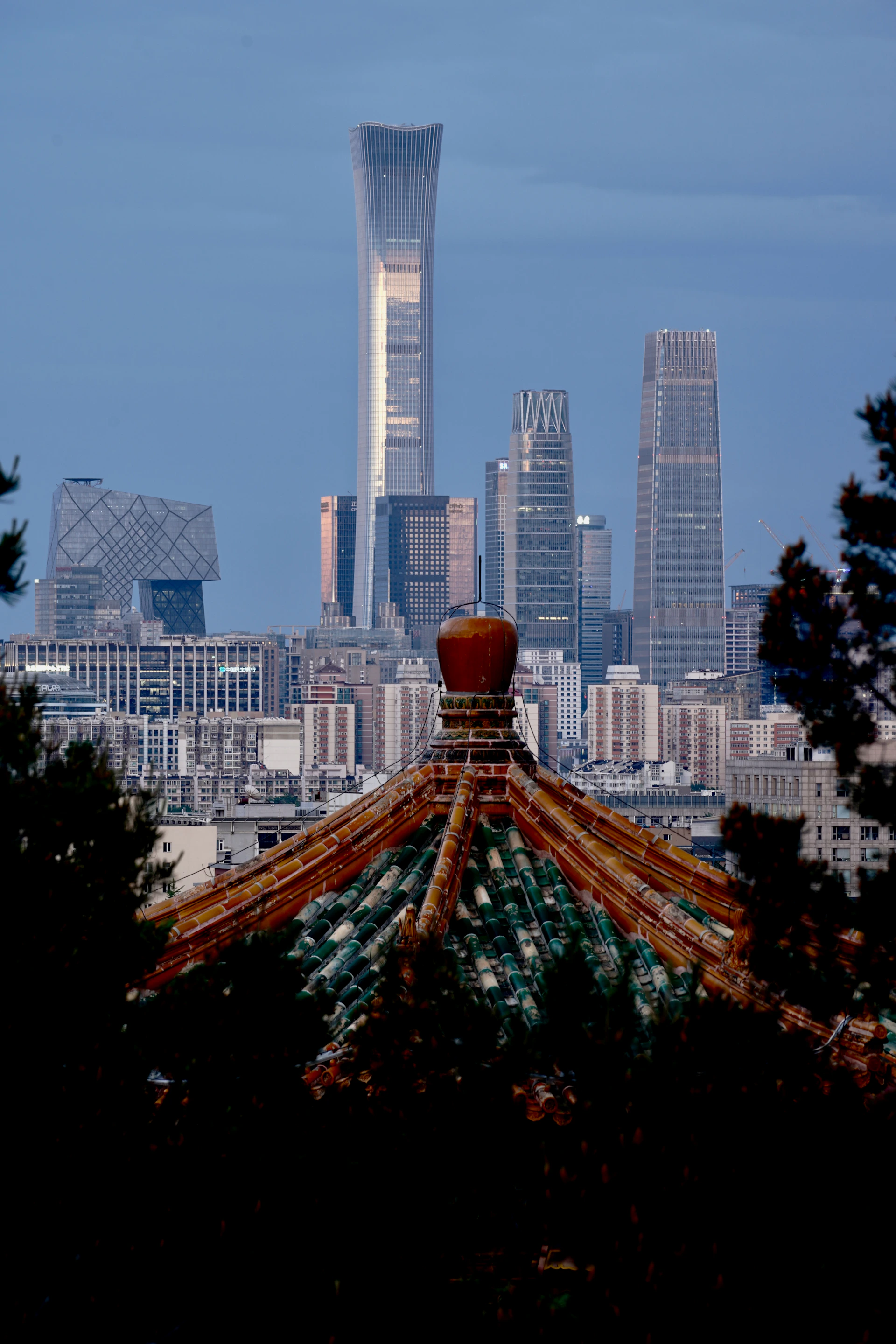 Beijing skyline with modern architecture and foreground structure.