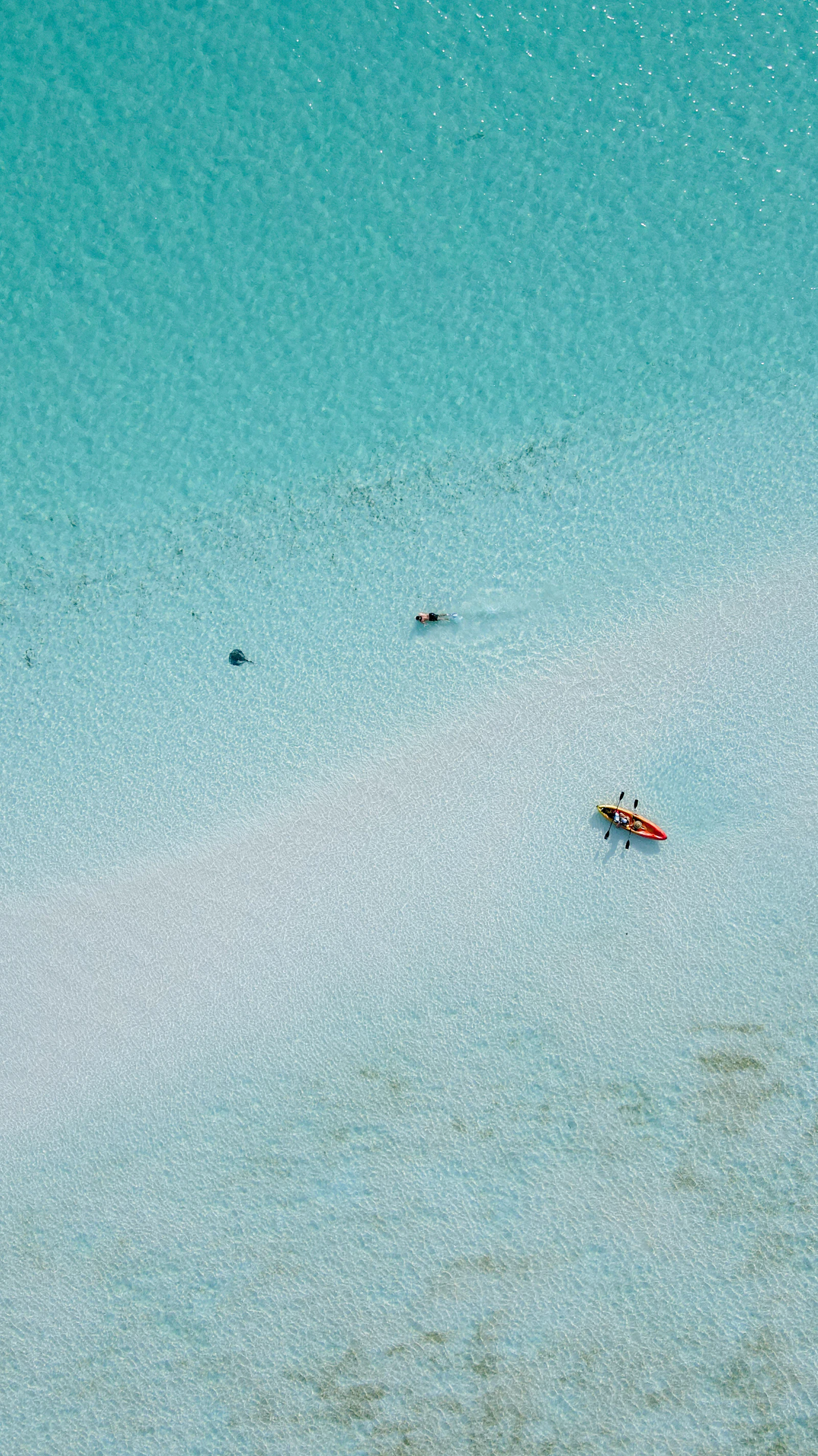 Family beach day with white sand and turquoise water in the Caribbean.