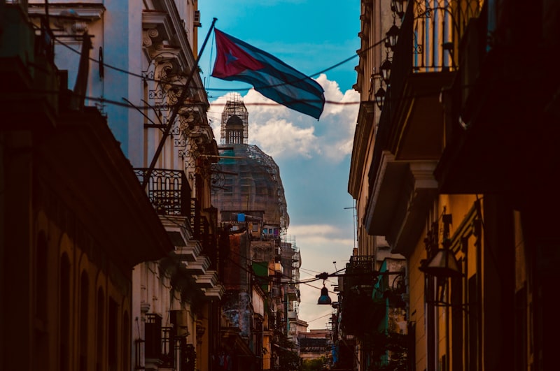 Cuban flag waves over a city street