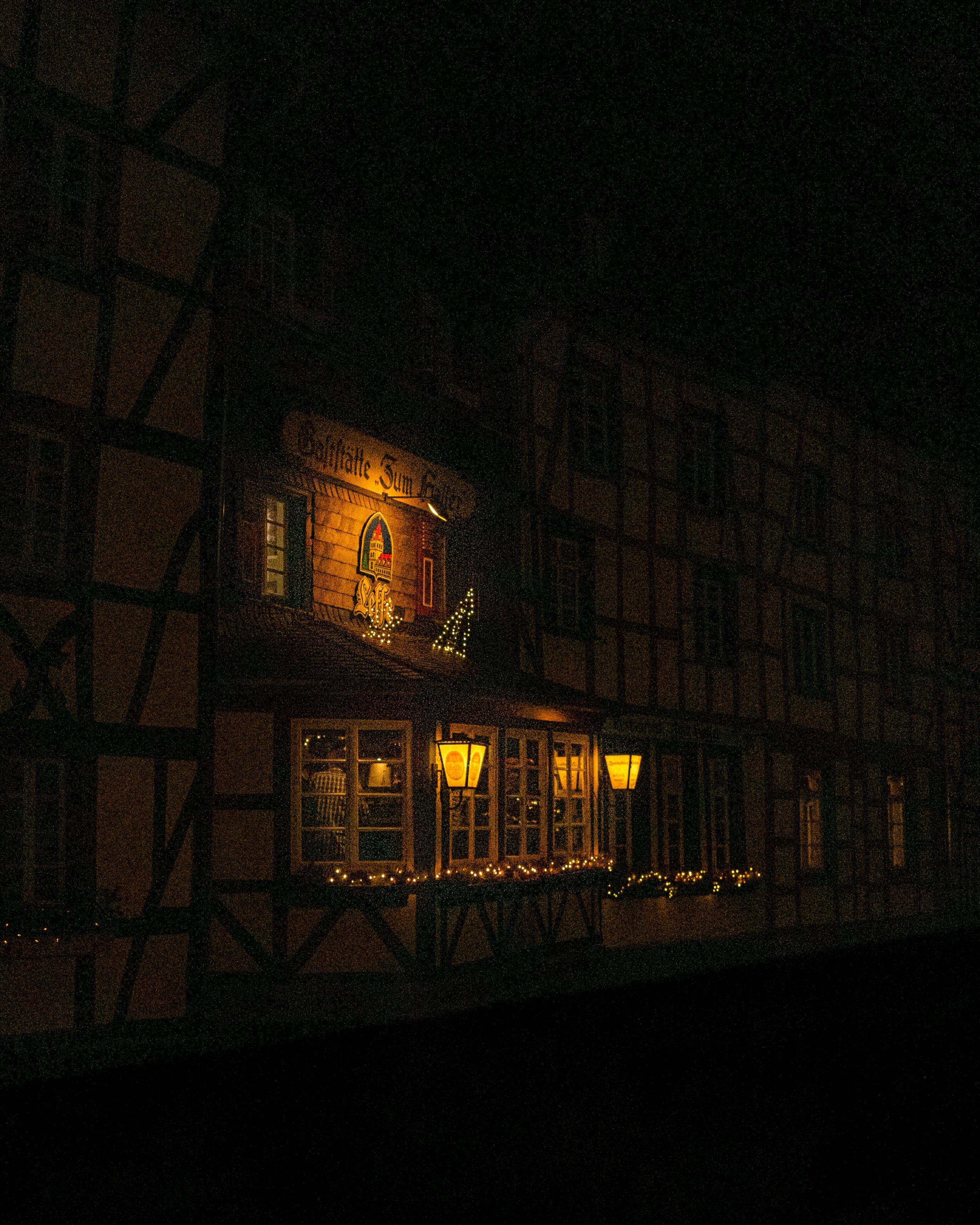 Cozy, illuminated building at night.
