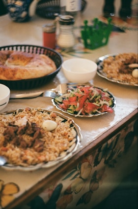 Food is spread out on a table, ready to eat.