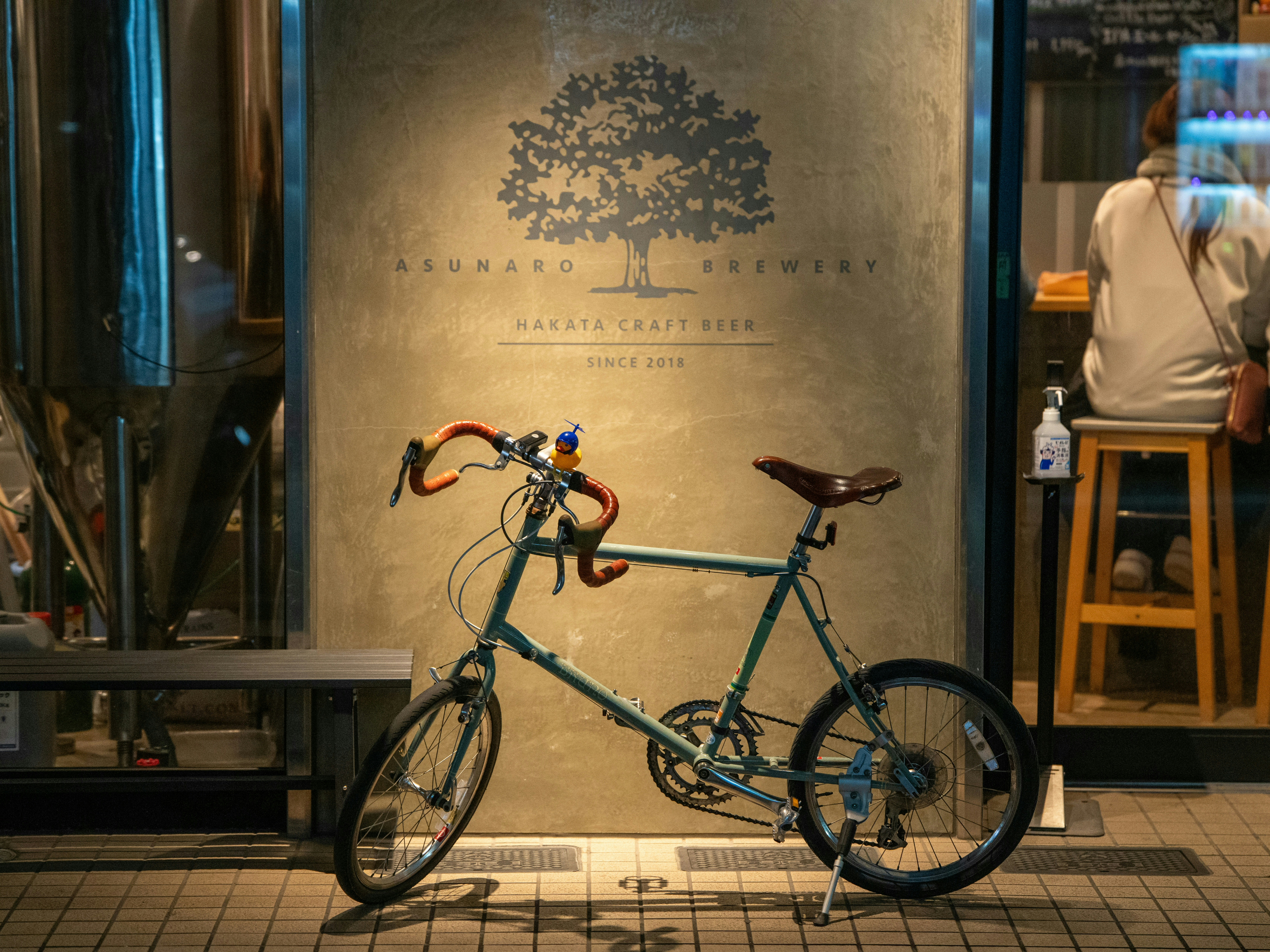 A bike rests outside of a craft brewery.