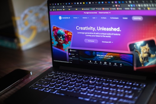 A laptop shows a website about ai creativity.