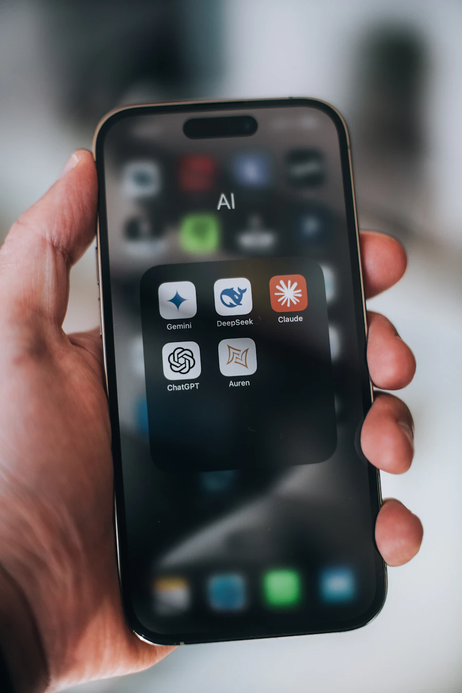 Hand holding a smartphone surrounded by digital marketing app icons and data graphics