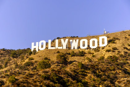 The hollywood sign is visible on a hill.