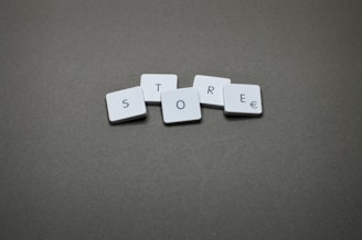 The word "store" is spelled with tiles.
