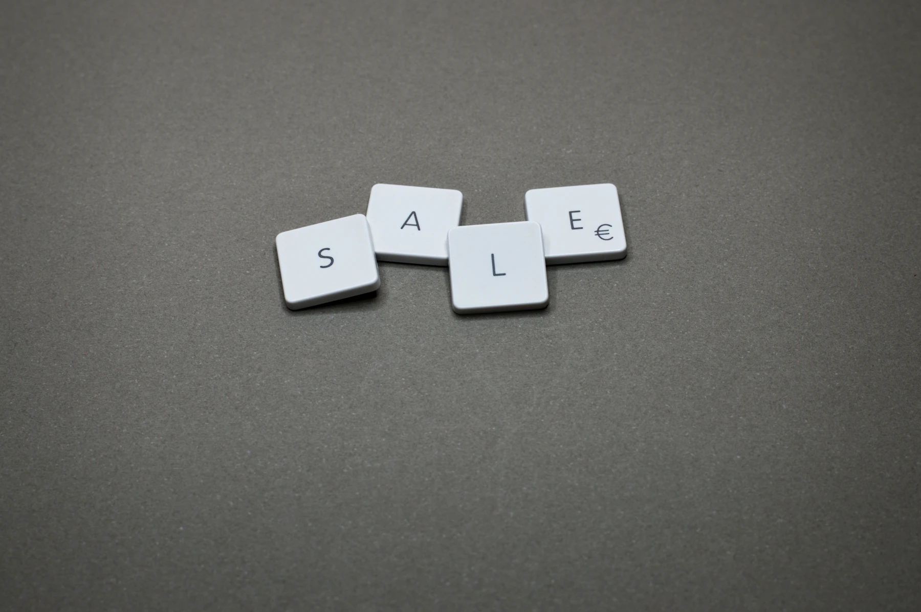 Sale spelled out with letter tiles