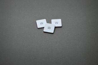 Three tiles with the letter "w" on them.
