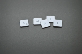 The word "email" is spelled out with letter tiles