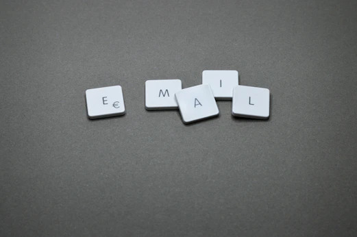 The word "email" is spelled out with letter tiles
