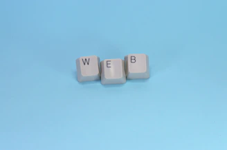 Keyboard keys spell out the word "web."