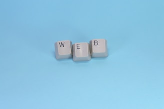 Keyboard keys spell out the word "web."