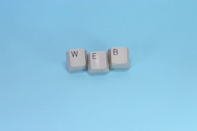 Keyboard keys spell out the word "web."