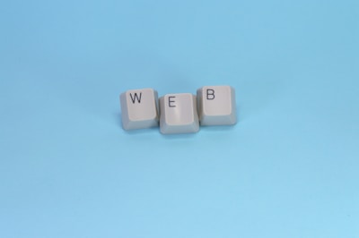 Keyboard keys spell out the word "web."