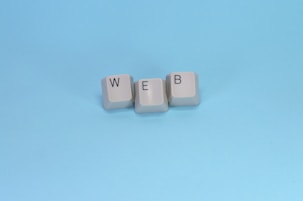 Keyboard keys spell out the word "web."