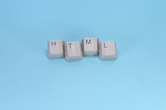 Html spelled out with keyboard keys.