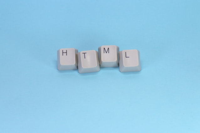 Html spelled out with keyboard keys.