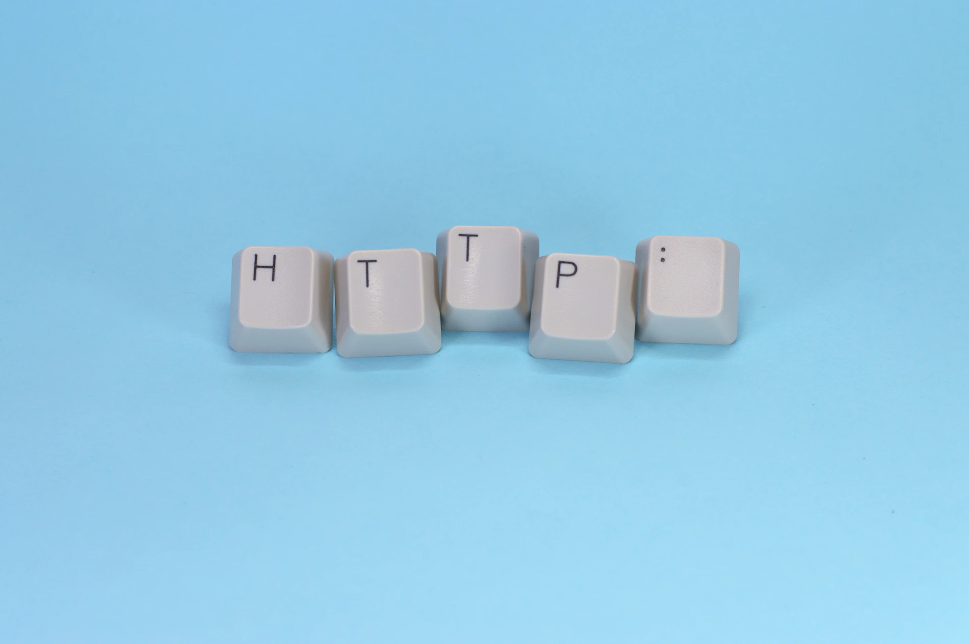 Keys spell out "http" on a blue background.