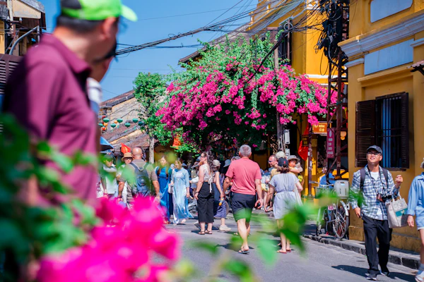 Visitors walking along an old-town street in Hoi An