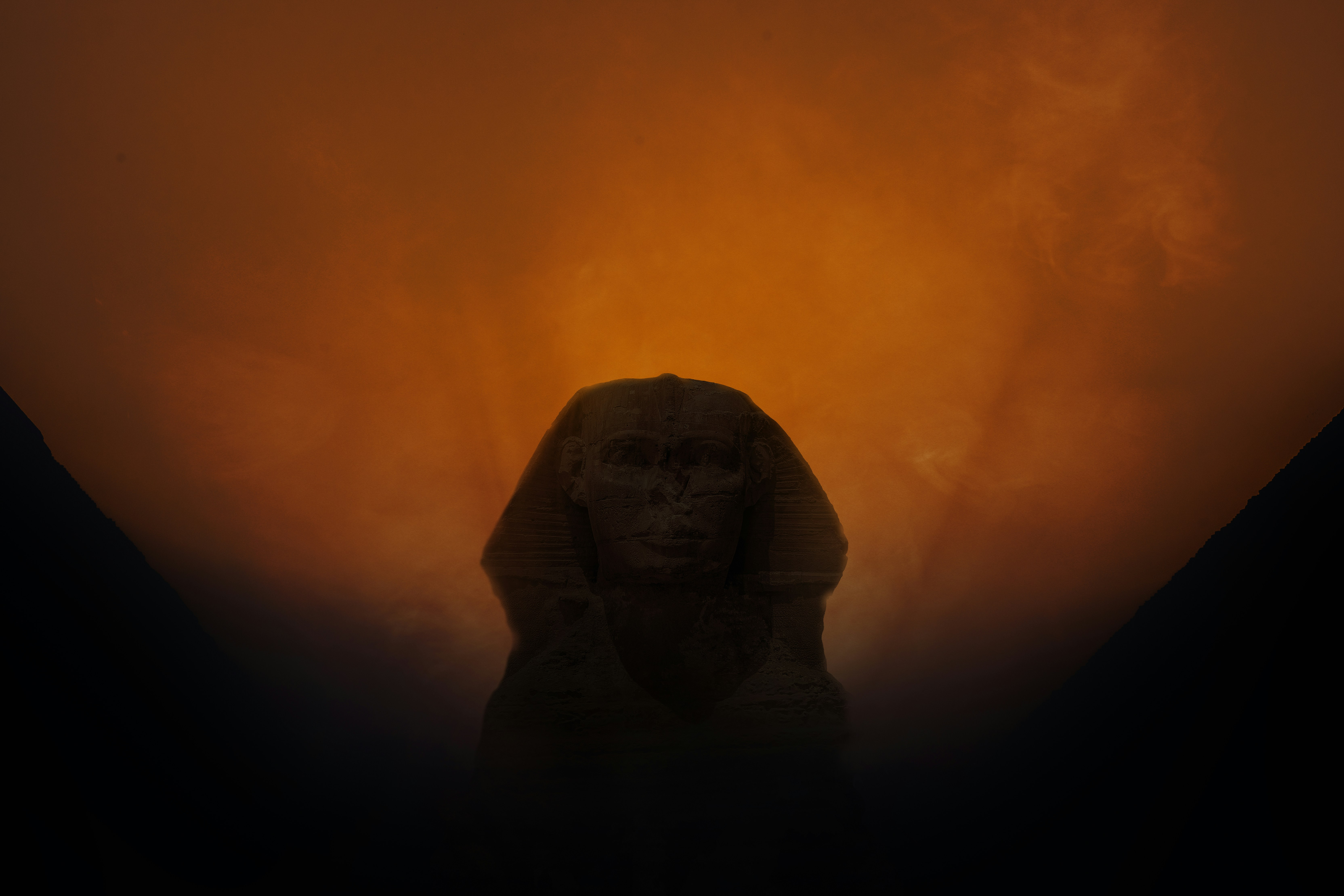 The great sphinx is silhouetted against orange sky. photo – Free Woman ...
