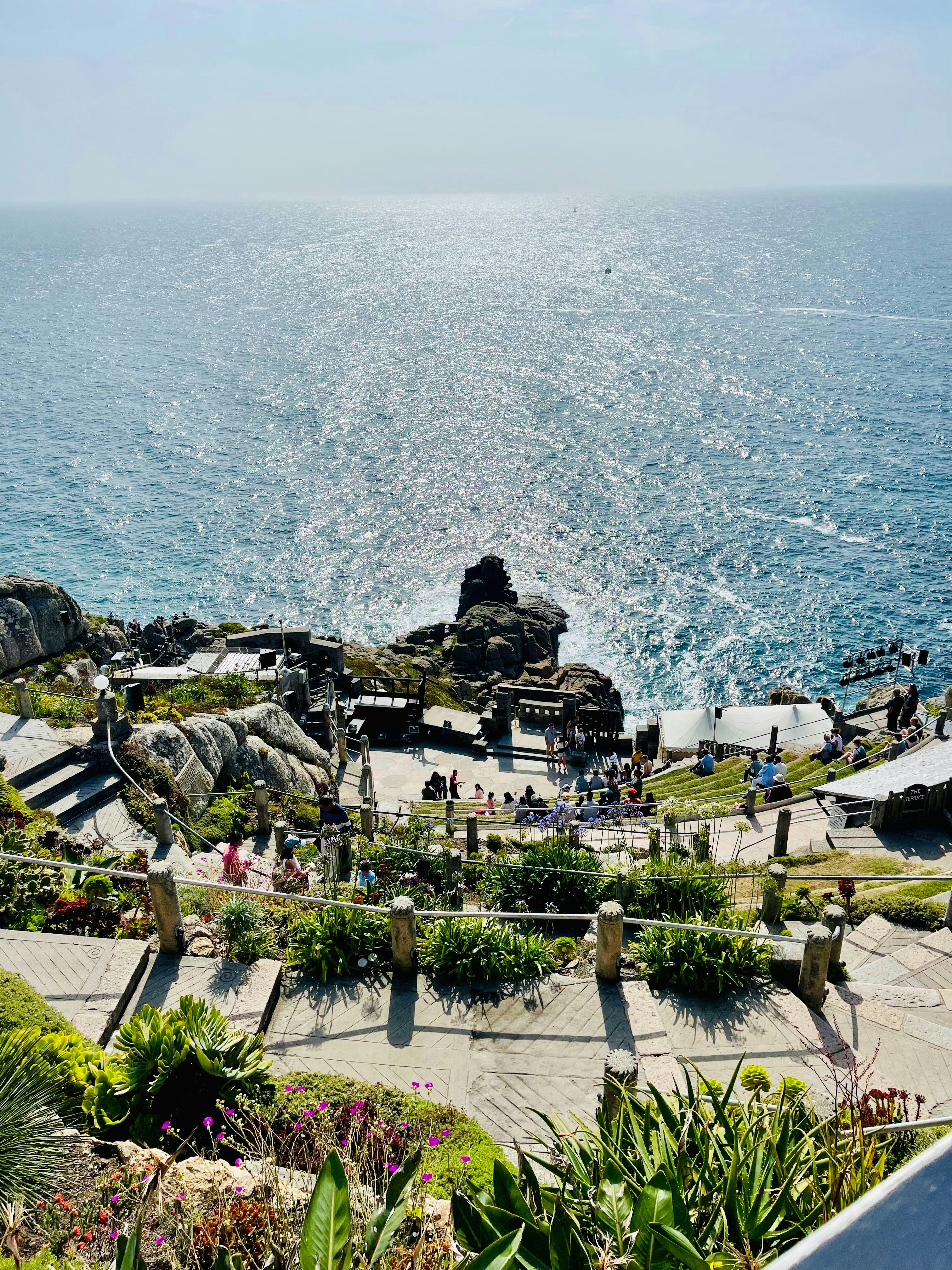 Coastal view with boardwalks and the sparkling ocean.