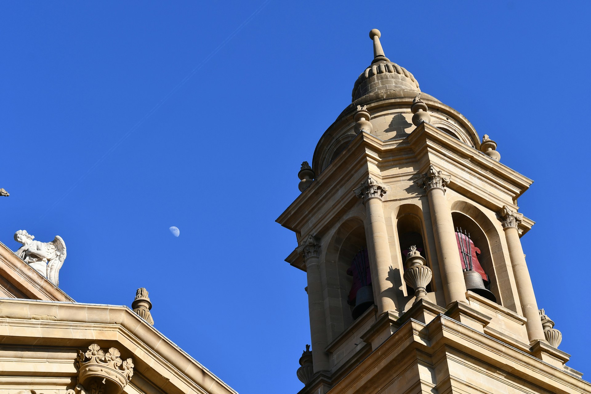 Church steeple against a clear, blue sky.