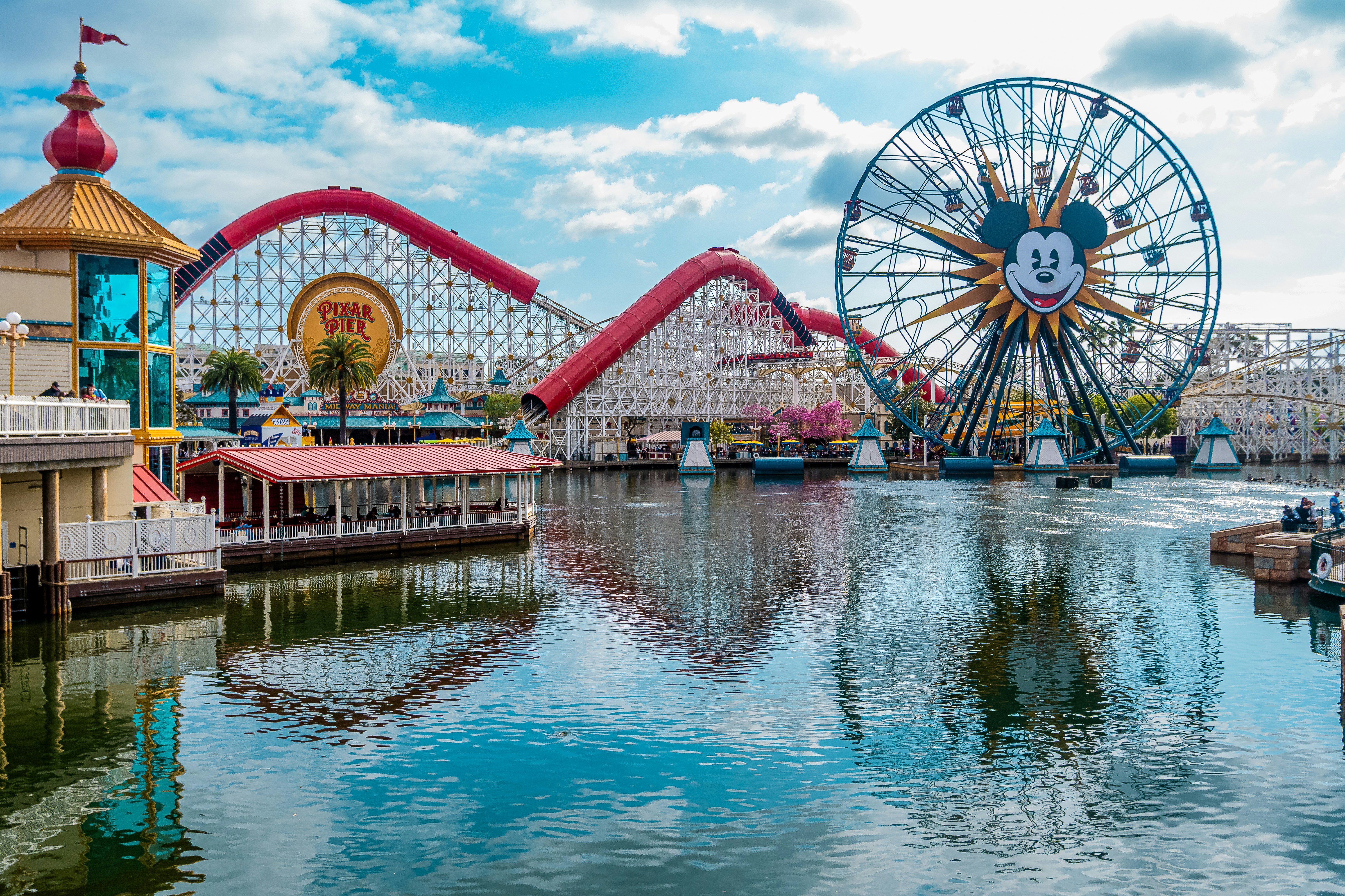 Disneyland park with rollercoasters and a ferris wheel.