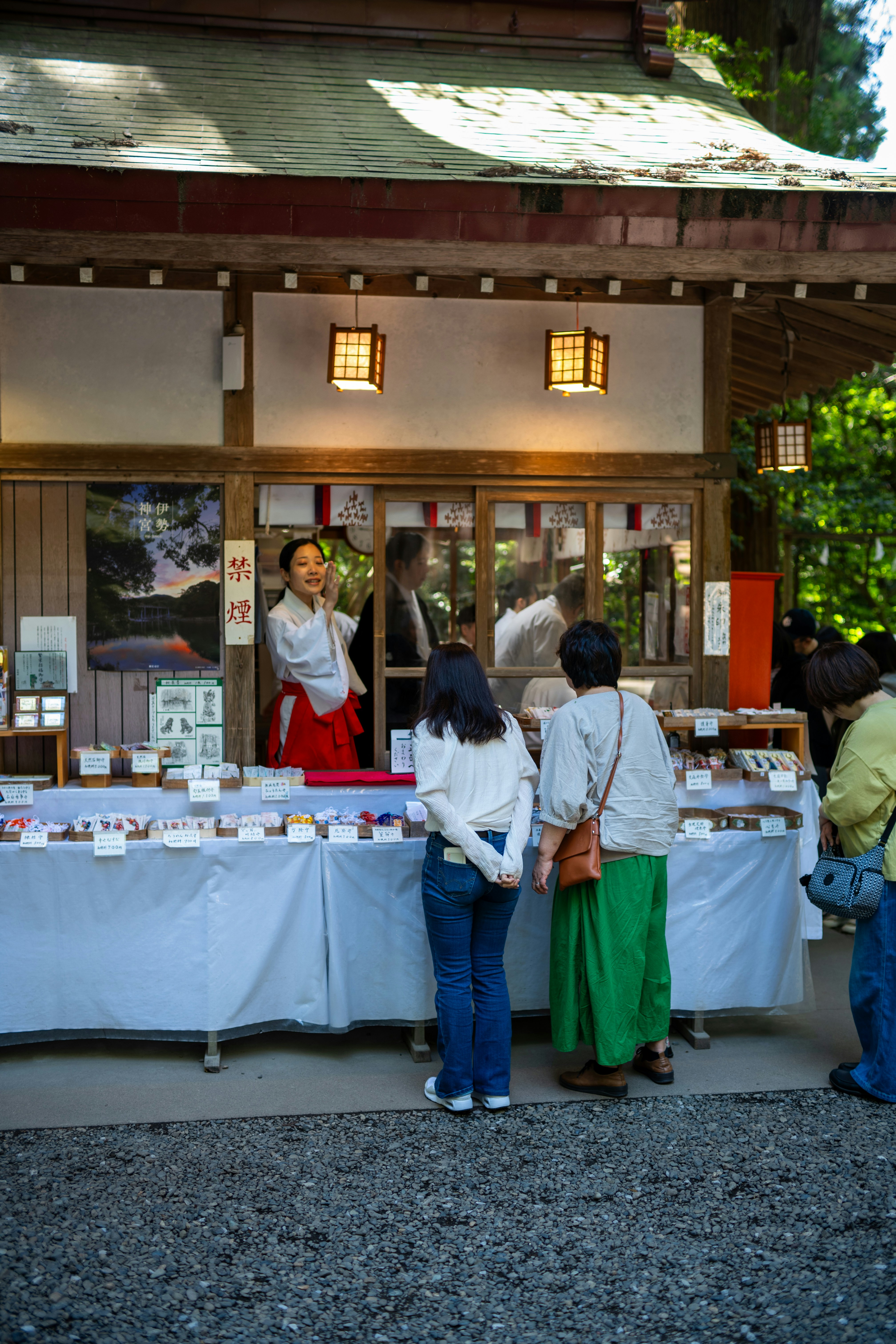 People are shopping at a japanese shrine.