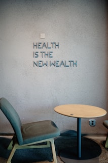 Health is the new wealth, shown near a chair.