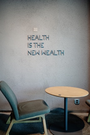 Health is the new wealth, shown near a chair.