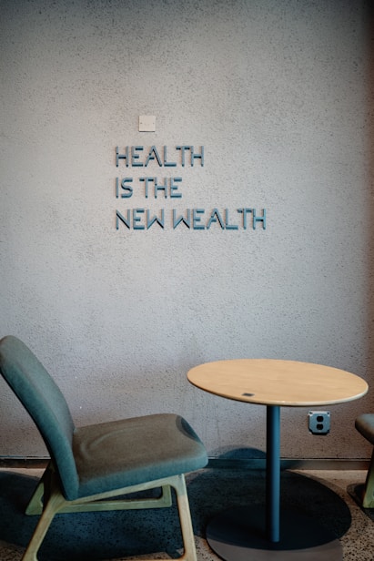 Health is the new wealth, shown near a chair.