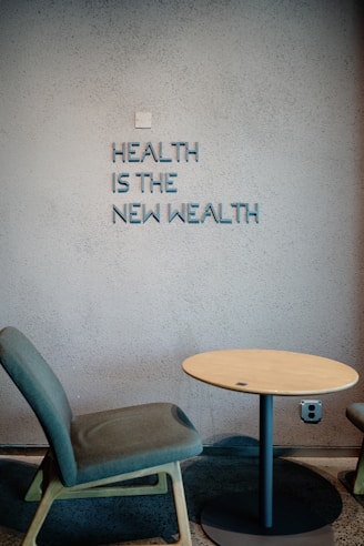 Health is the new wealth, shown near a chair.