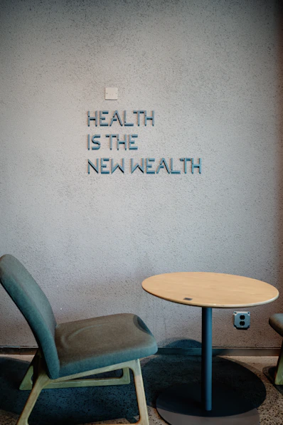 Health is the new wealth, shown near a chair.