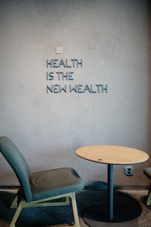 Health is the new wealth, shown near a chair.