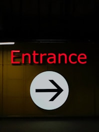 Entrance sign directs people to the right.