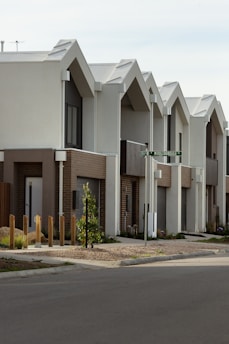 Row of modern houses with interesting roof design.
