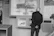 A man observes a museum display of model airplanes.