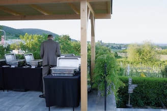A man prepares food at a buffet table.