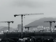 Construction cranes populate the cityscape